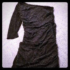 Tight sparkly black asymmetrical mini dress